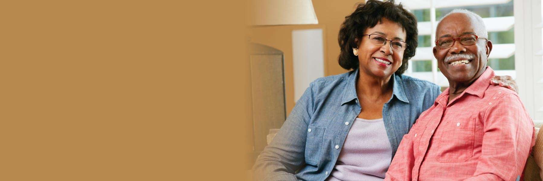 A couple smiling with their full set of teeth in Lakeland FL