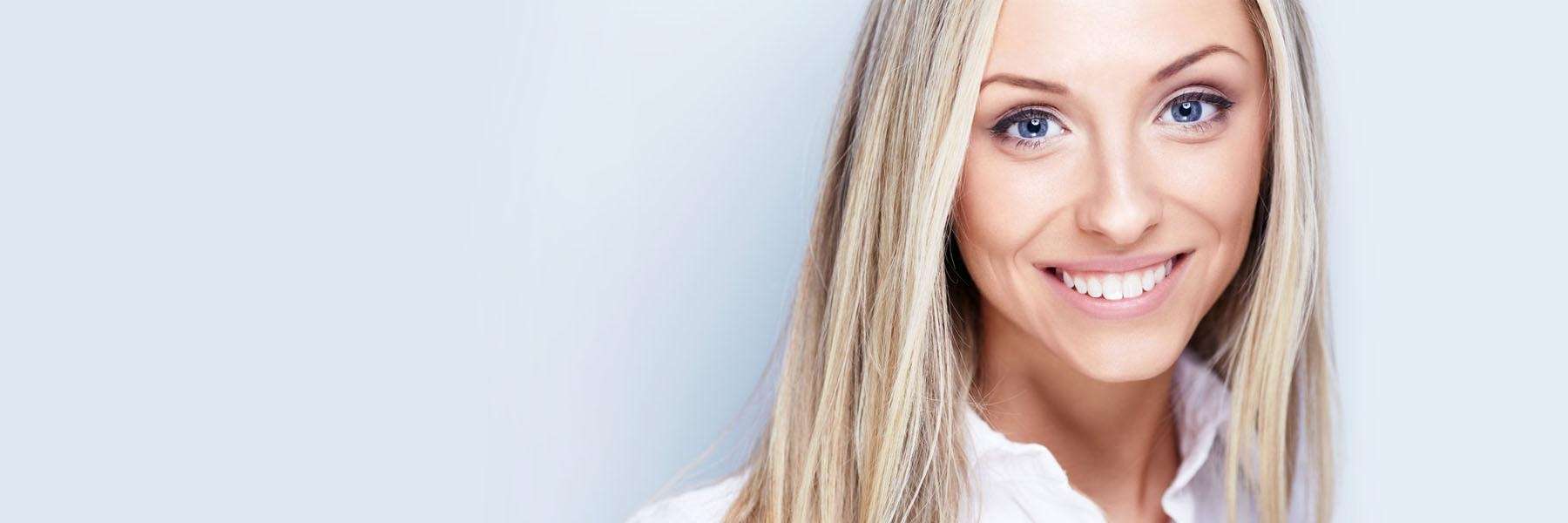 Woman smiling at cosmetic dentist in Lakeland, FL