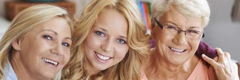 Three generation of woman that have white and healthy teeth in Florida