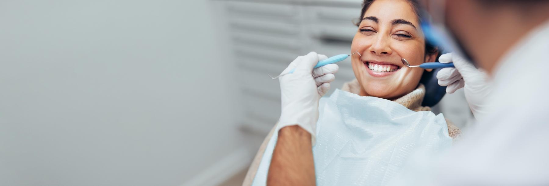 Woman smiling at cosmetic dentist in Lakeland FL