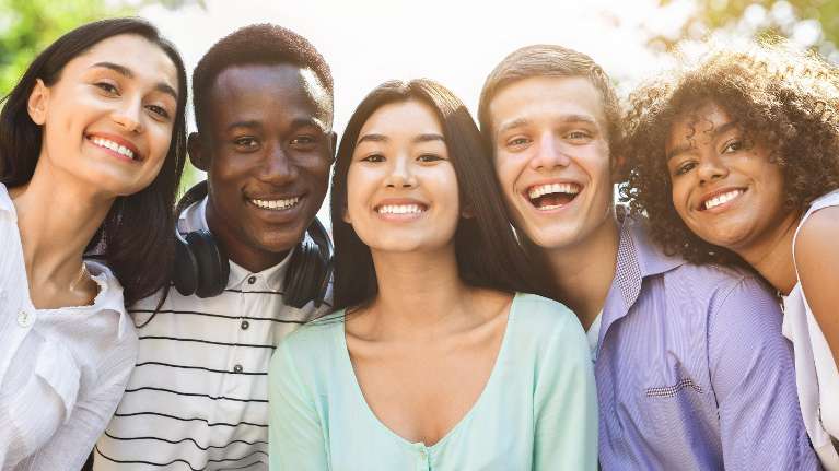 Group of young people free of gum disease and with good dental health in Florida