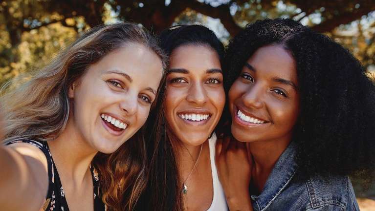 Group of woman smiling with their clean white teeth in Lakeland, FL