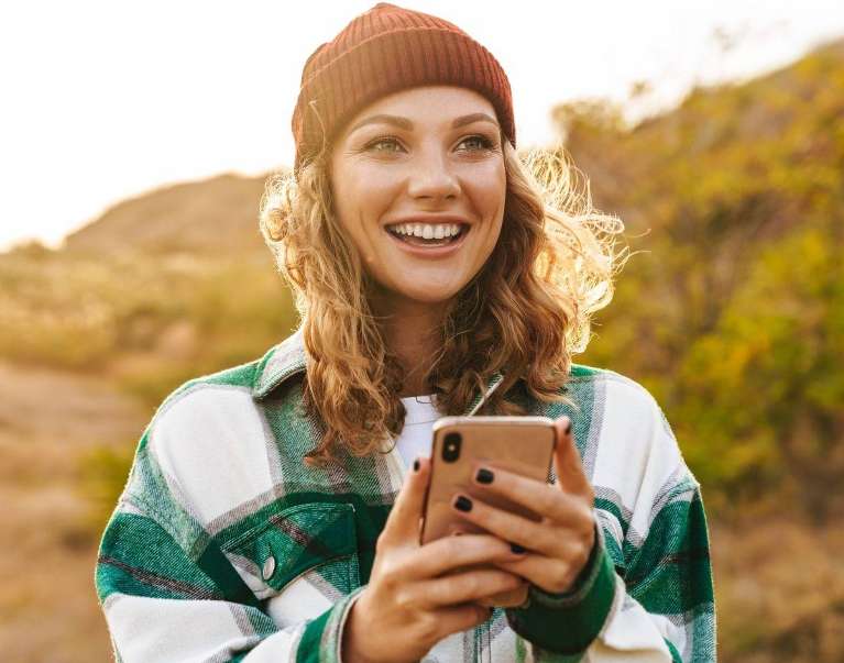 A woman smiling after a Dental visit in Lakeland, FL