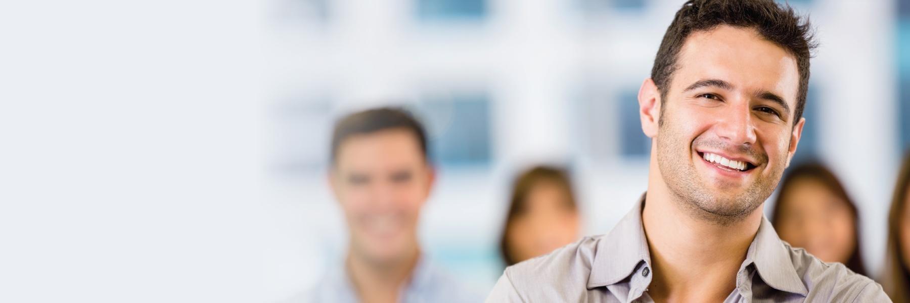 Brunette man smiling at dentist office in Lakeland FL